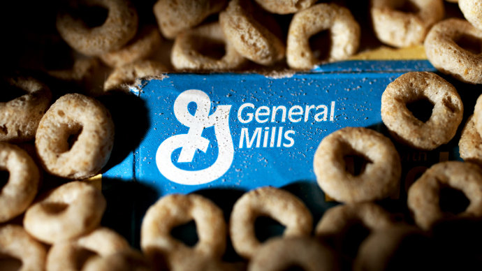 The General Mills Inc. logo is surrounded by Cheerios in this arranged photograph in Washington, D.C., U.S., on Friday, Feb. 17, 2012. General Mills Inc., the maker of Cheerios cereal and Yoplait yogurt, reduced its earnings forecast for its current fiscal year as weak demand and rising costs squeeze food producers. Photographer: Andrew Harrer/Bloomberg via Getty Images
