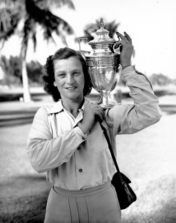 Babe Didrikson Zaharias poses with her trophy at the Miami Biltmore Country Club in Miami, Fl. on Feb. 1, 1947.  Zaharias was presented the challenge cup for winning the Helen Lee Doherty Women's Invitational Championship golf tournament. (AP Photo)
